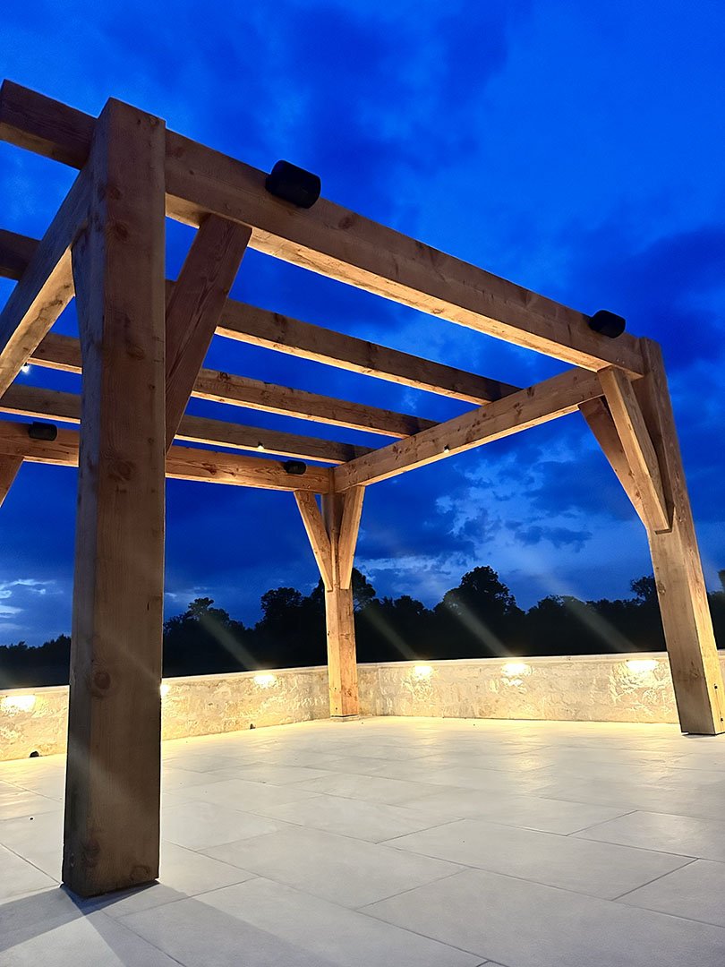 Elegant Outdoor Lighting on Modern Patio Wooden pergola with LED lighting by Light it Right in Houston